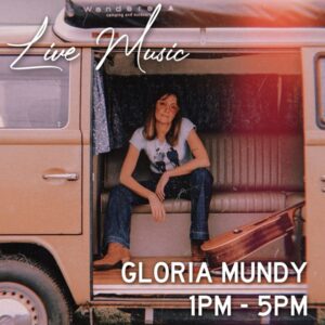 Gloria sitting in a van